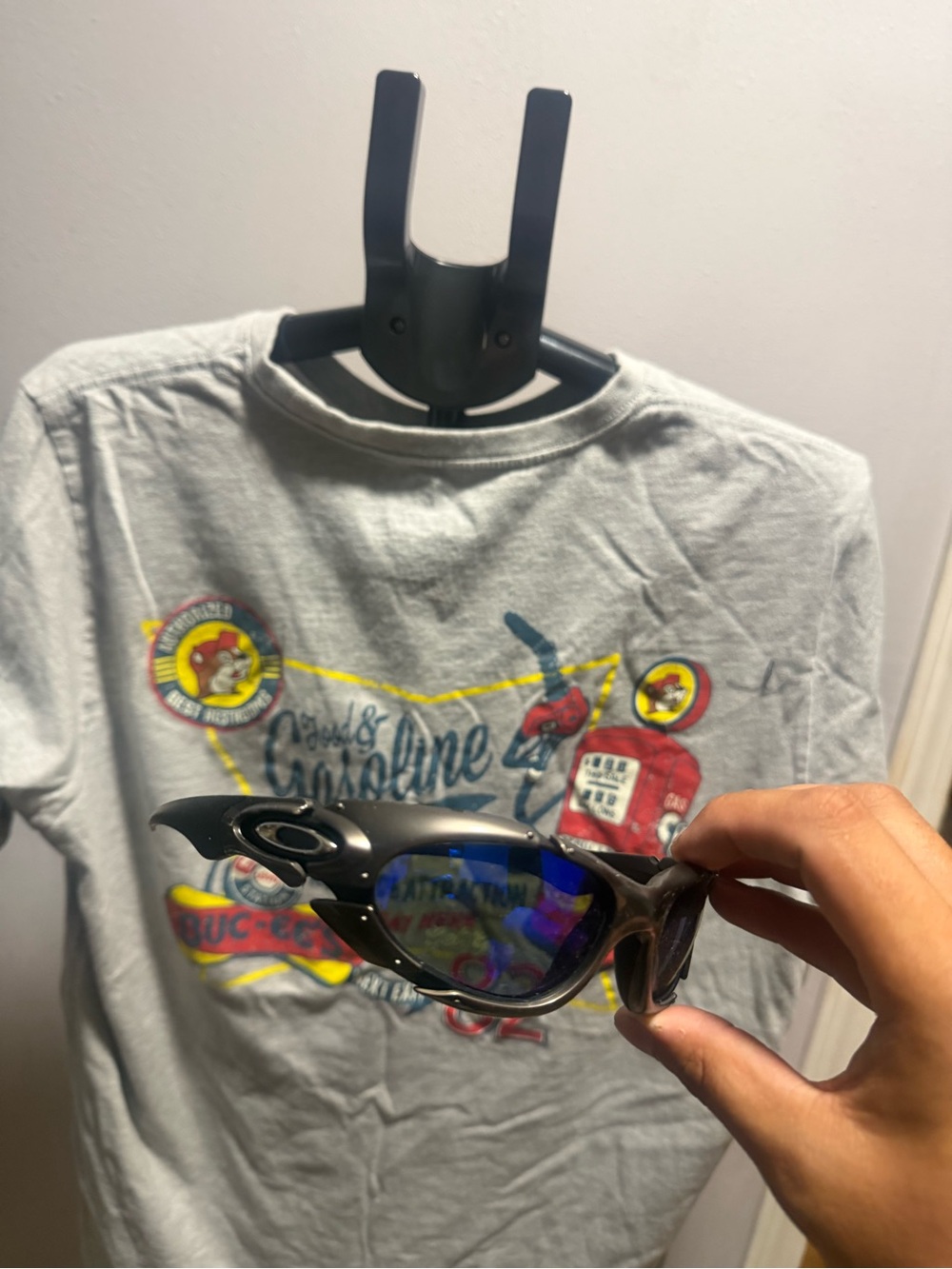 Oakley Black Frame Sunglasses with Blue Mirrored Lenses